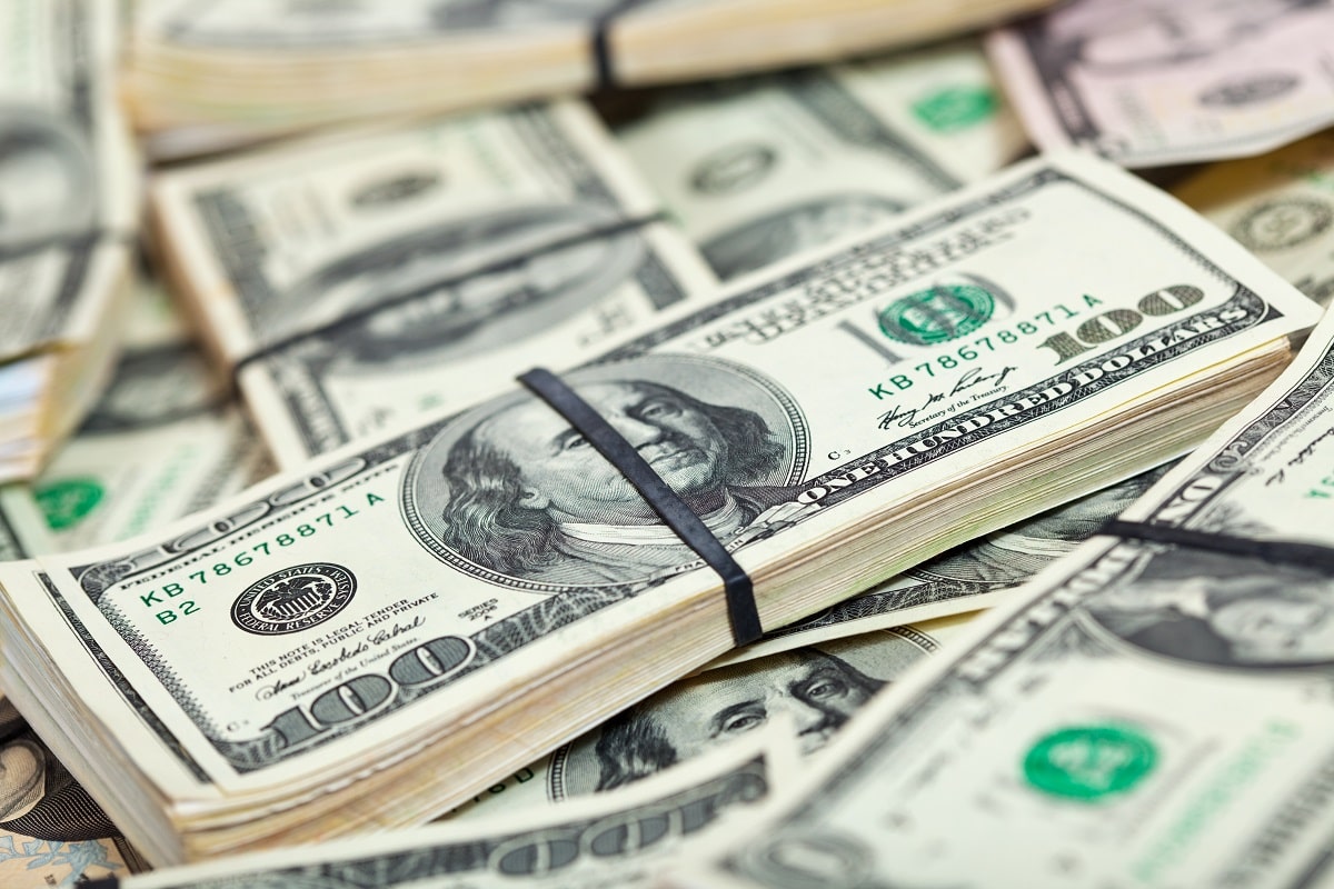 many-us-dollars-banknotes-min